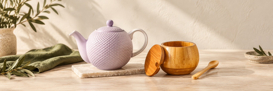 Lilac textured teapot beside a bamboo spice jar and spoon