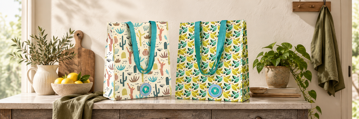 Two colourful floral shopping bags in a bright hallway