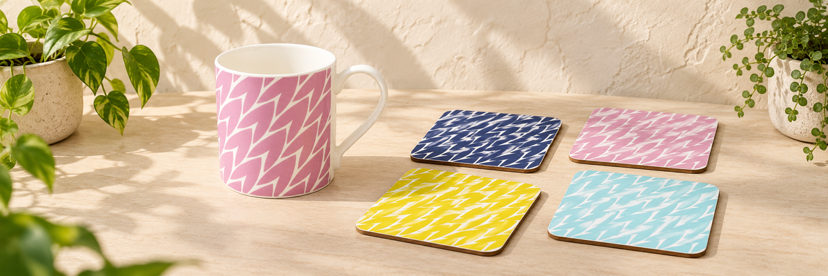 Leaf Large Bone China Mug - Pink and Leaf Print Drink Coasters Mixed Colours Set Of 4 arranged in a warm, softly lit setting.