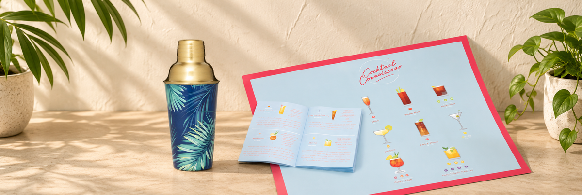 Tropical Palm Leaf Cocktail Shaker - Brass and Cocktail Poster arranged in a warm, softly lit setting.