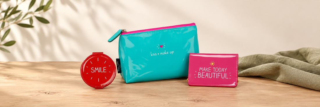 Red compact mirror, turquoise makeup bag and pink card holder
