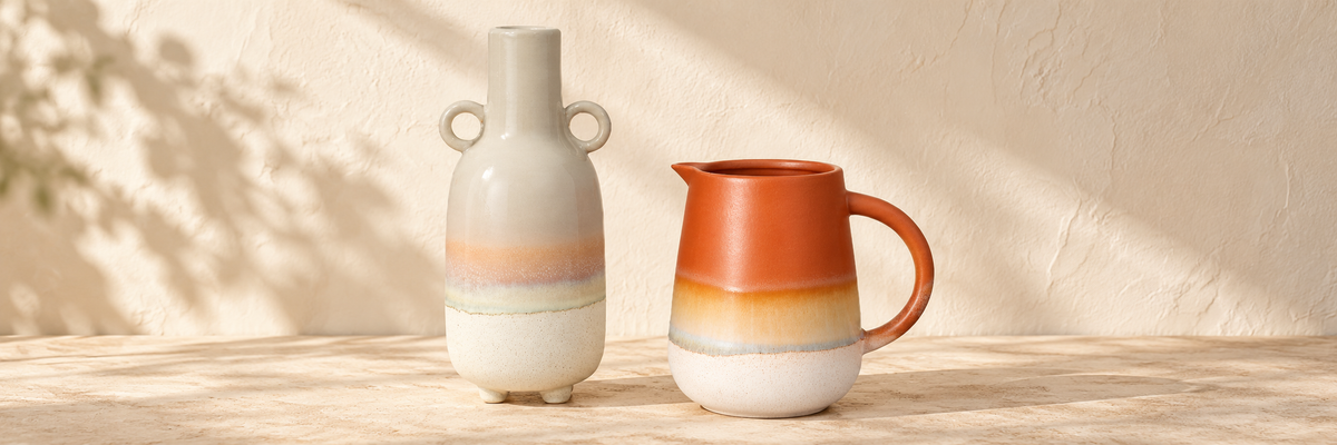 Mojave Glaze Grey Large Vase and Mojave Glaze Jug Terracotta arranged in a warm, softly lit setting.