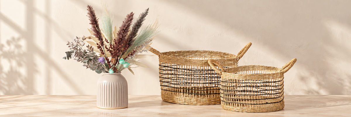 Grooved Vase - Speckled Grey and Seagrass Open Weave Baskets arranged in a warm, softly lit setting.