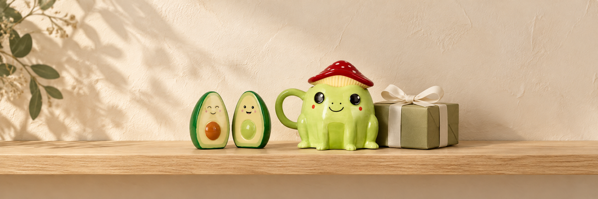 Avocado salt and pepper shakers, a frog mug with mushroom lid and an olive-wrapped gift