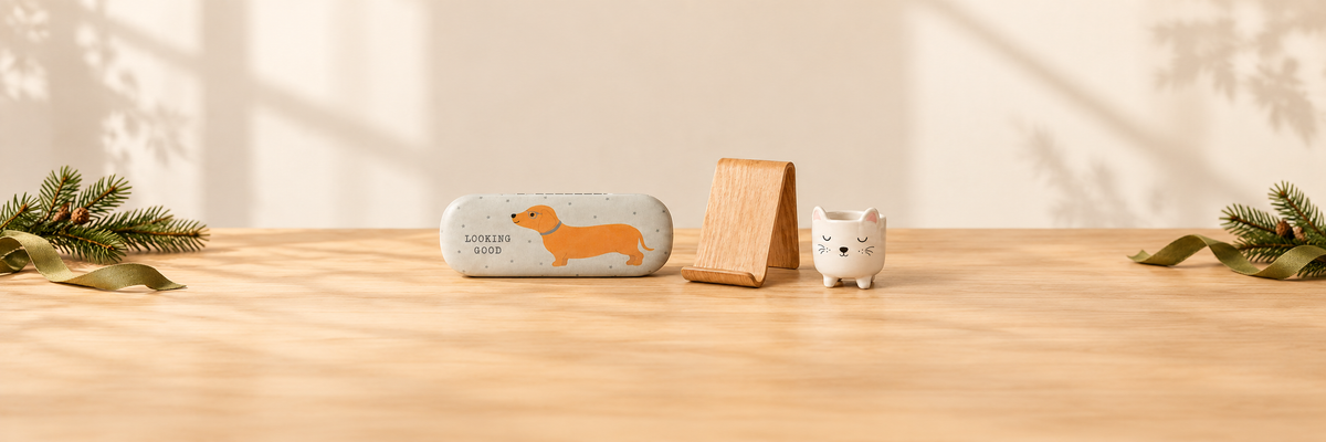 Dachshund glasses case, willow wood phone stand and mini cat planter with festive greenery.