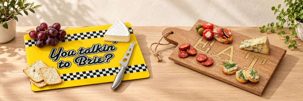 Cheesy Boards - You Talkin' To Brie? and Mango Wood Paddle Serving Board arranged in a warm, softly lit setting.