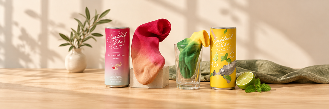Pink Cosmopolitan and green Mojito socks with cocktail-themed gift packaging