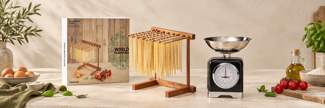 Wooden kitchen accessories beside black mechanical kitchen scales