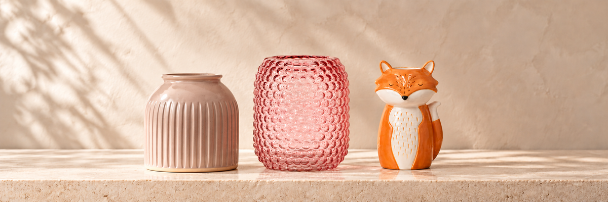 Grooved Vase - Speckled Grey and Glass Bobble Vase - Pink and Finley Fox Vase arranged in a warm, softly lit setting.