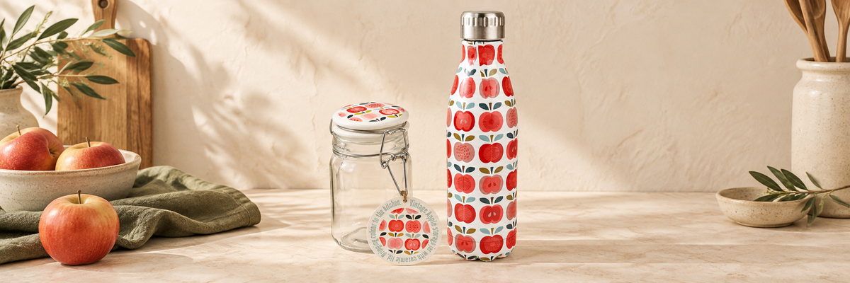 Apple-patterned bottle beside a glass storage jar