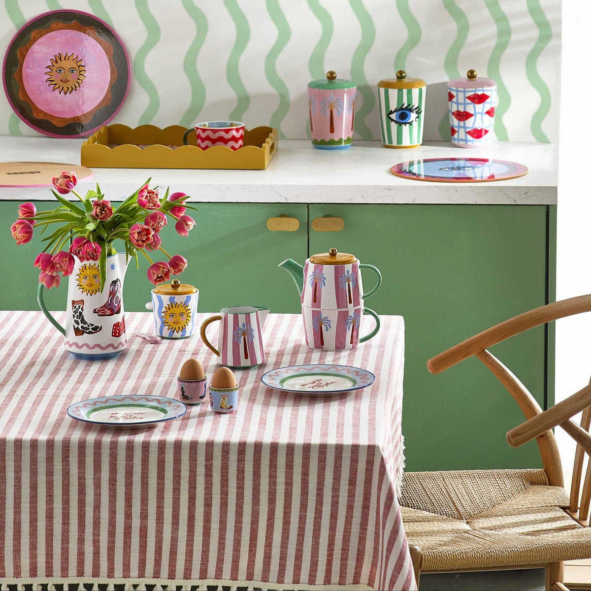 Eleanor Bowmer Palm Milk Jug styled on a striped dining table