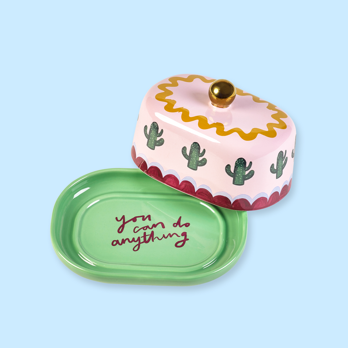 Eleanor Bowmer butter dish with lid lifted to reveal the message inside its green base