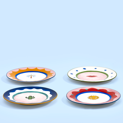 Low-angle view of four Eleanor Bowmer Electric Coast Icon cake plates