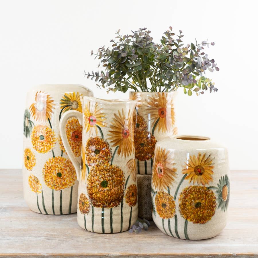 Sunflower Jug Vase styled with other floral vessels and foliage