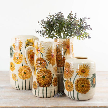 Sunflower Jug Vase styled with other floral vessels and foliage