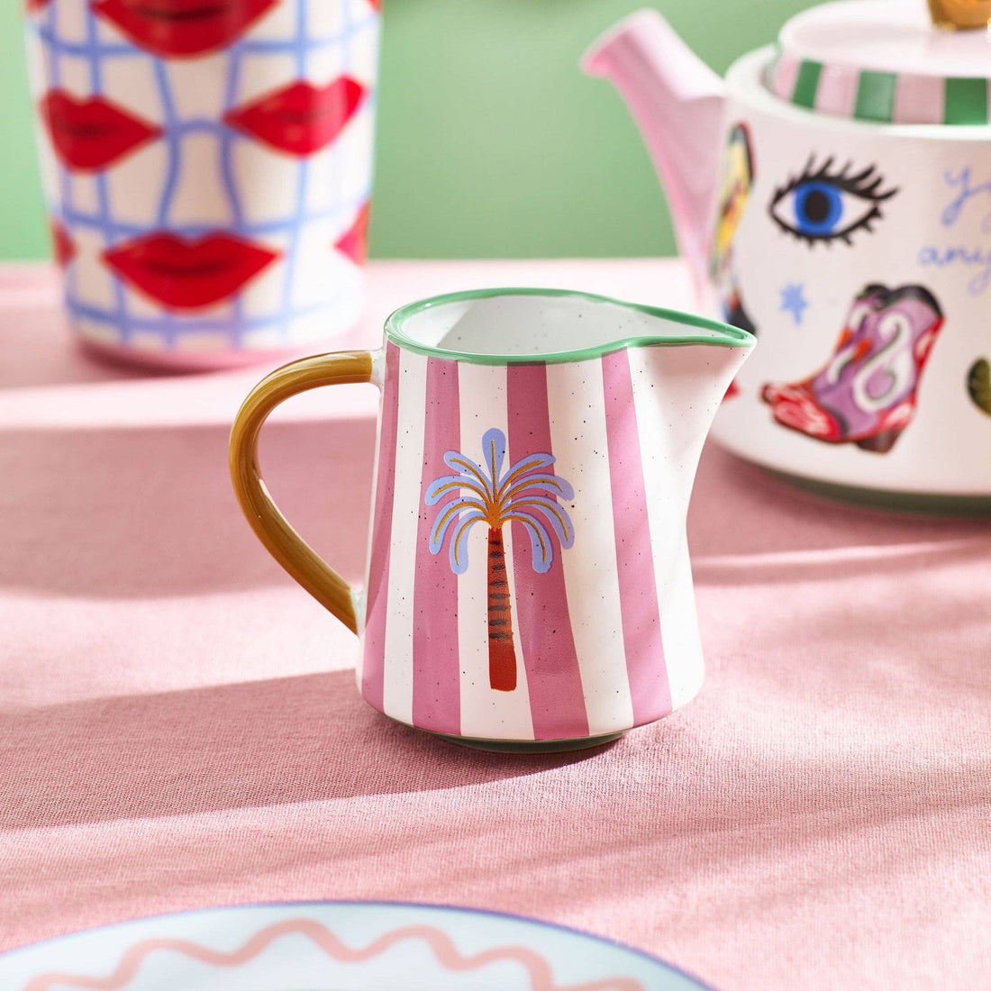 Eleanor Bowmer Palm Milk Jug with pink stripes styled on a pink tablecloth