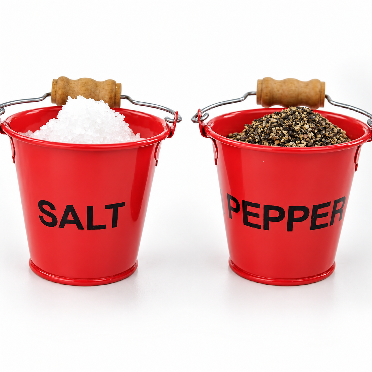 Red SALT and PEPPER fire bucket pinch pots filled with coarse salt and ground pepper, shown side by side