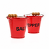 Red salt and pepper fire bucket pinch pots with wooden grip handles on a white background